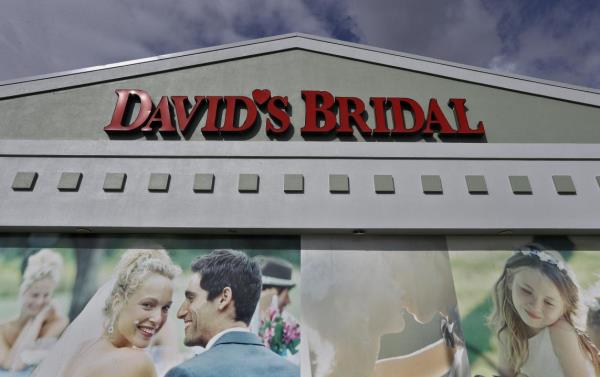 FILE - The David's Bridal shop is shown Nov. 19, 2018, in Tampa, Fla. David’s Bridal filed for bankruptcy protection Monday, April 17, 2023 the second time that the firm has sought such protection in the last five years. The announcement came just days after the company, one of the largest sellers of wedding gowns and formal wear, said it could be eliminating 9,236 positions across the United States. The Conshohocken, Pennsylvania-ba<em></em>sed retailer employs more than 11,000 workers, (AP Photo/Chris O'Meara, file)