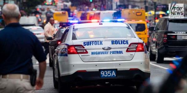 Suffolk Highway Patrol remains parked outside of 385 Fifth Avenue