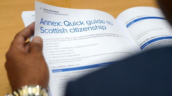 A person reads a policy paper on citizenship in an independent Scotland at its launch by First Minister Humza Yousaf, at the Natio<em></em>nal Records Of Scotland in Edinburgh. Picture date: Thursday July 27, 2023.