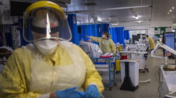 A nurse wearing PPE working on a patient in the ICU (Intensive Care Unit) in St George<em></em>'s Hospital in Tooting, south-west London. The Government is still being "too slow" to recover taxpayer mo<em></em>ney lost to fraud and error over the pandemic, MPs have said. FILE PIC